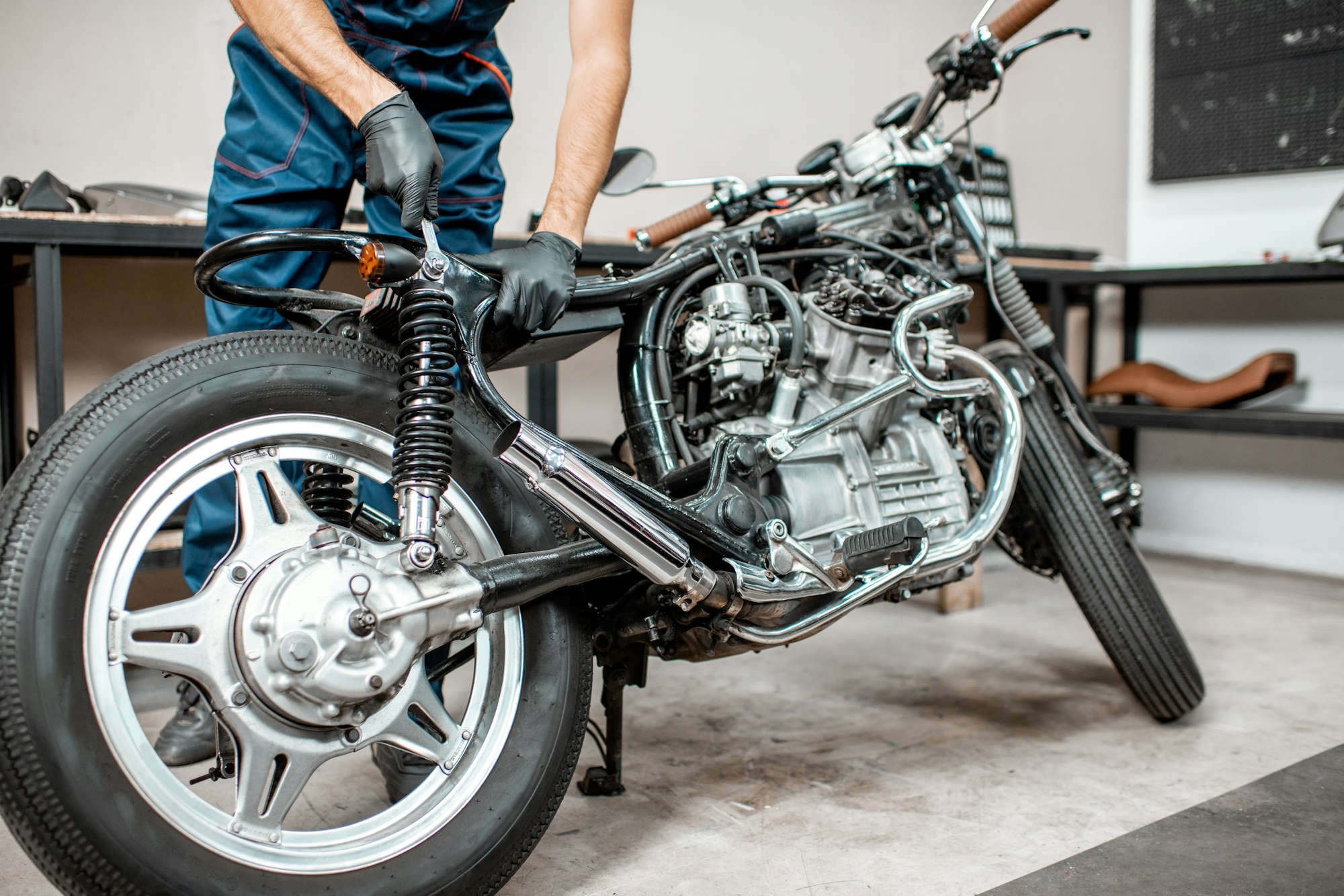 Repairing motorcycle in the workshop